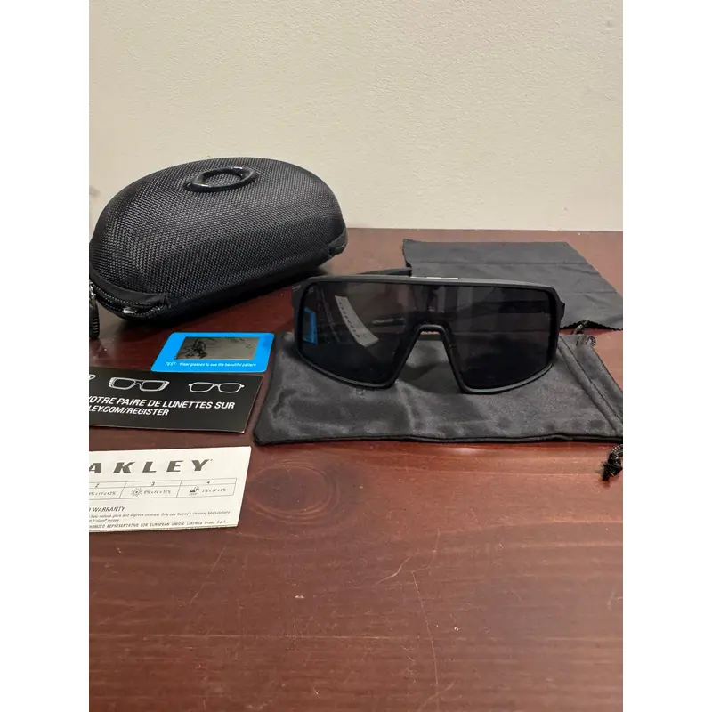 Black and black Oakley Sutros