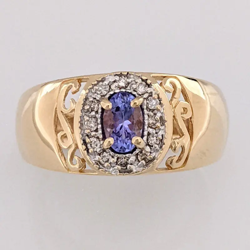 14K TANZANITE OVAL 3X5 WITH .12 DIAMOND TOTAL WEIGHT (12) ESTATE RING 5.5 GRAMS